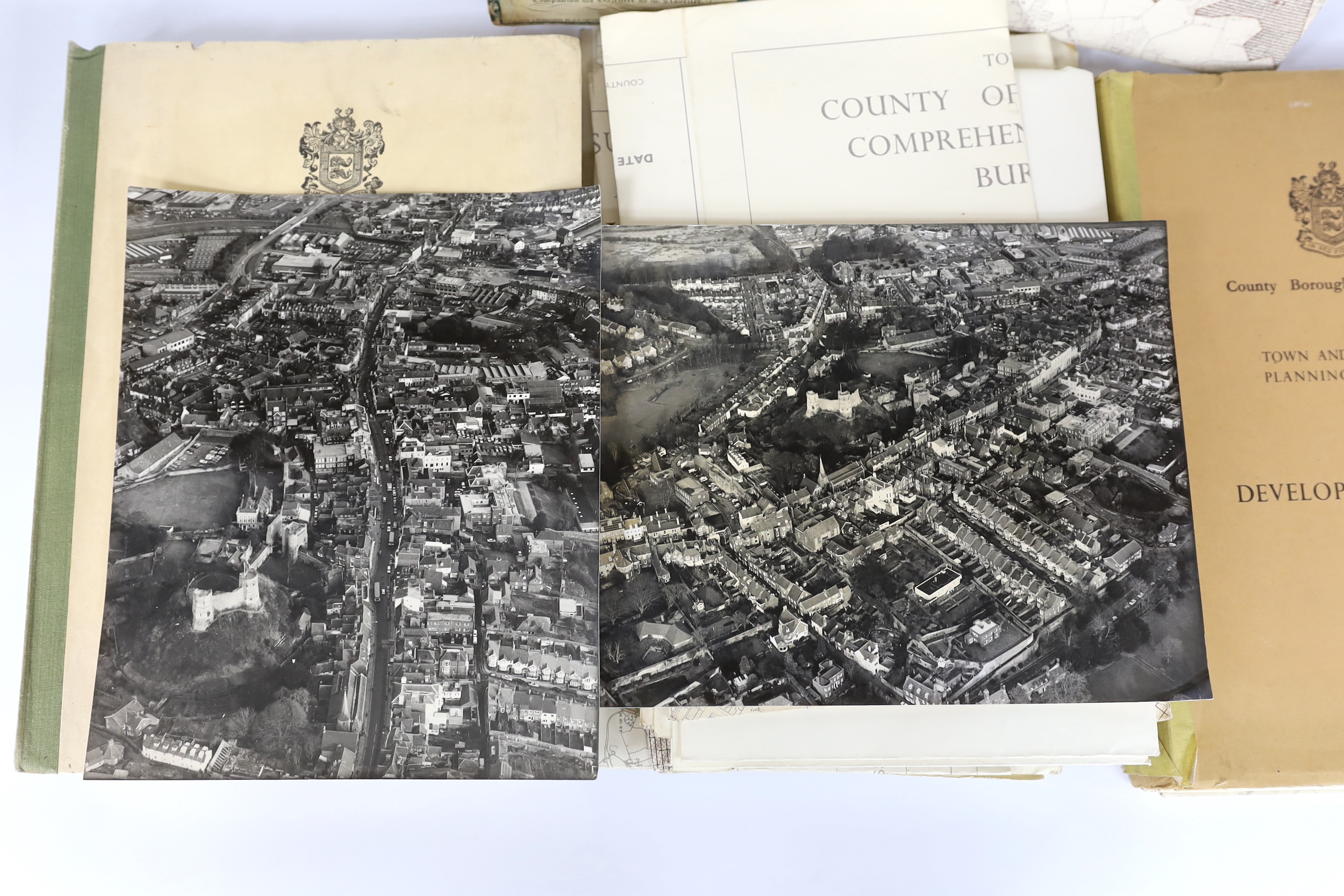 Two black and white aerial views of Lewes, East Sussex, 1986, 23 x 27cms; Crutchley’s New Map of England and Wales, on folding linen in 25 hand-coloured sections, scale 10 miles to an inch, London, 1827, 98 x 60cms; East